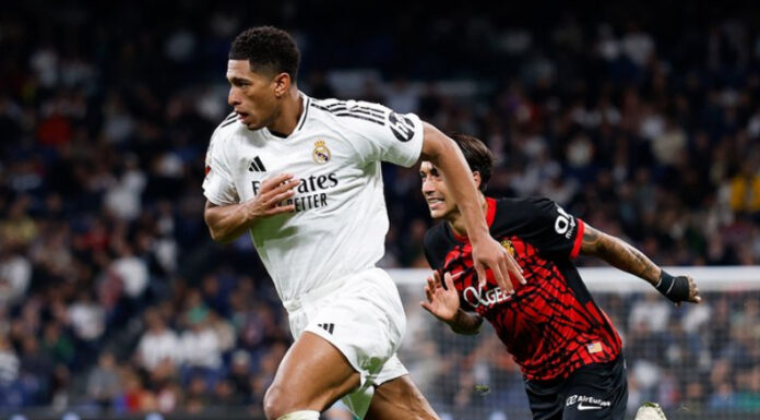 Real Madrid derrotó en tiempo agregado al Mallorca y retrasó, al menos un día, el título de liga para el Barcelona.