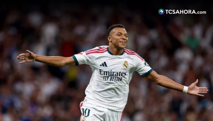 El Real Madrid se impuso en e Bernabéu al Rayo Vallecano y alcanzó, de manera provisional, al Barcelona en el liderato.